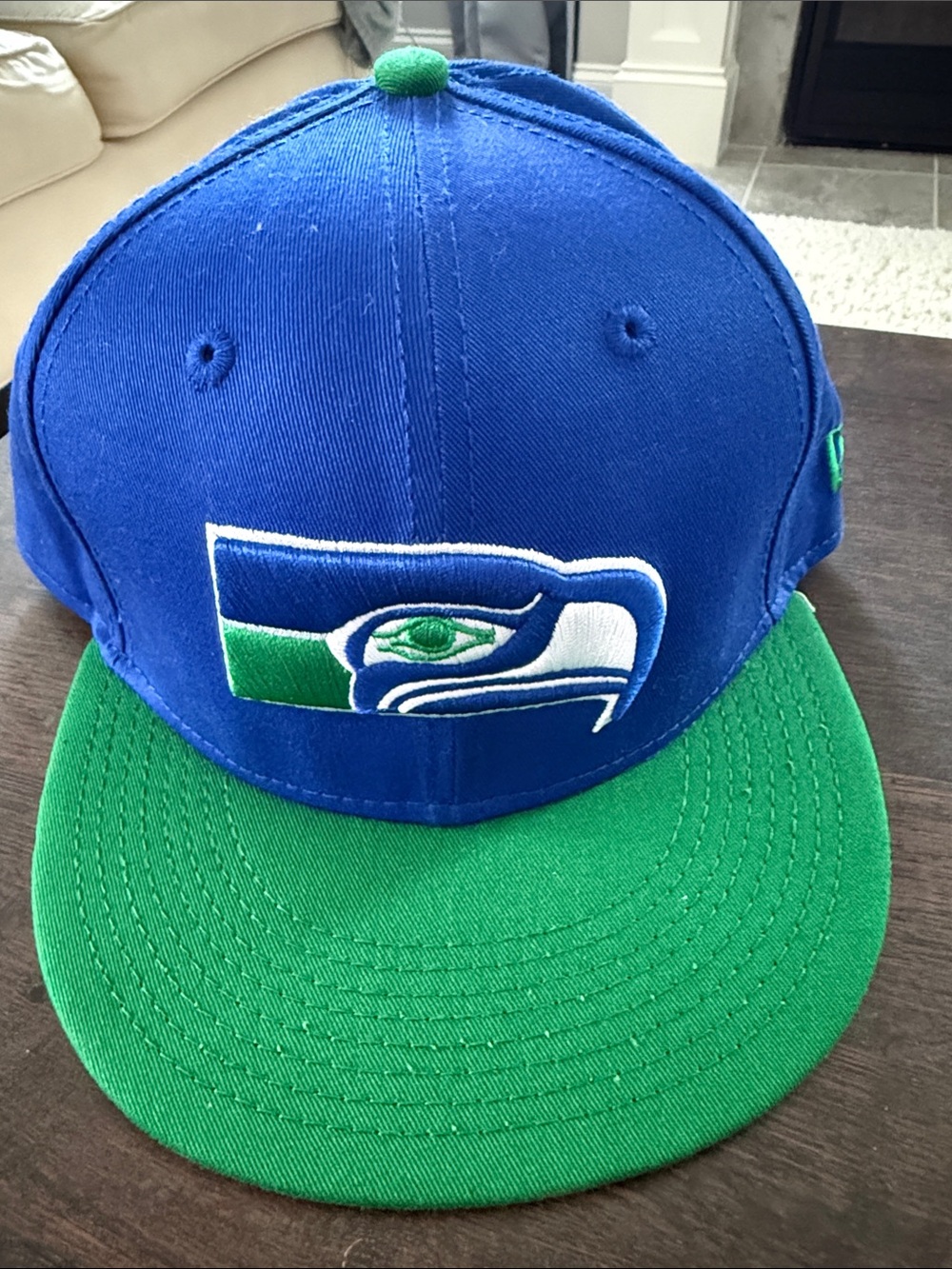 New Era royal blue hat with green accents